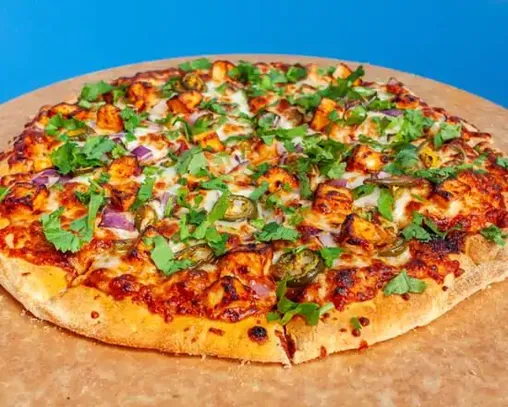 Desi-style pizza with authentic Indian flavors in Edmonton